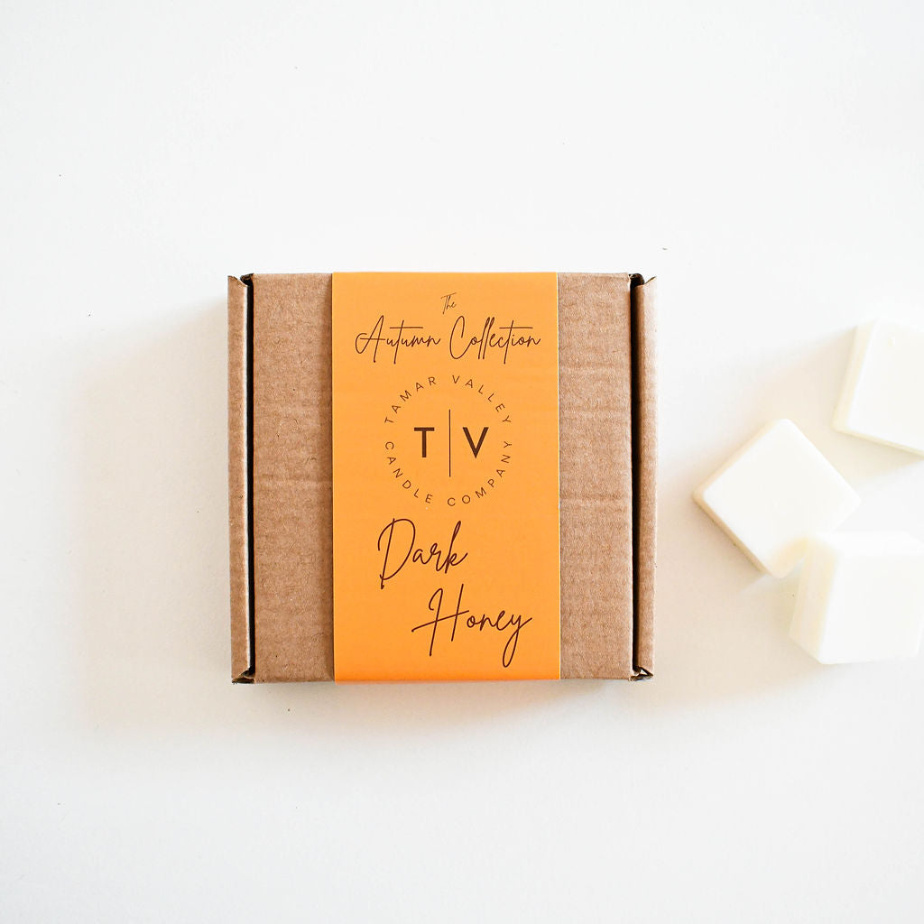 Eco-friendly soy wax melts in recyclable kraft packaging. Dark Honey scent